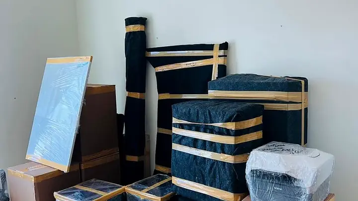GulfNest wrapped furniture prepared for residential packing and relocation