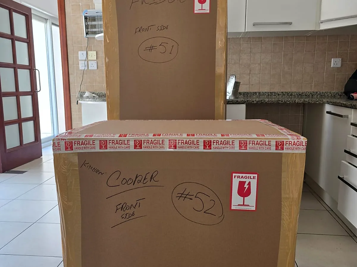 GulfNest fridge and cooler packed with protective board and fragile labels for storage handling